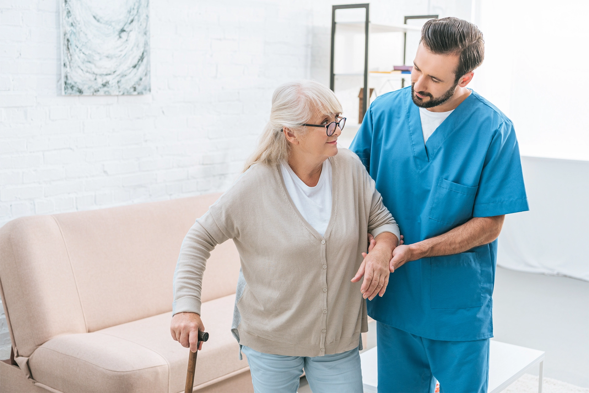 Hospice caregiver providing compassionate support to an older adult at home