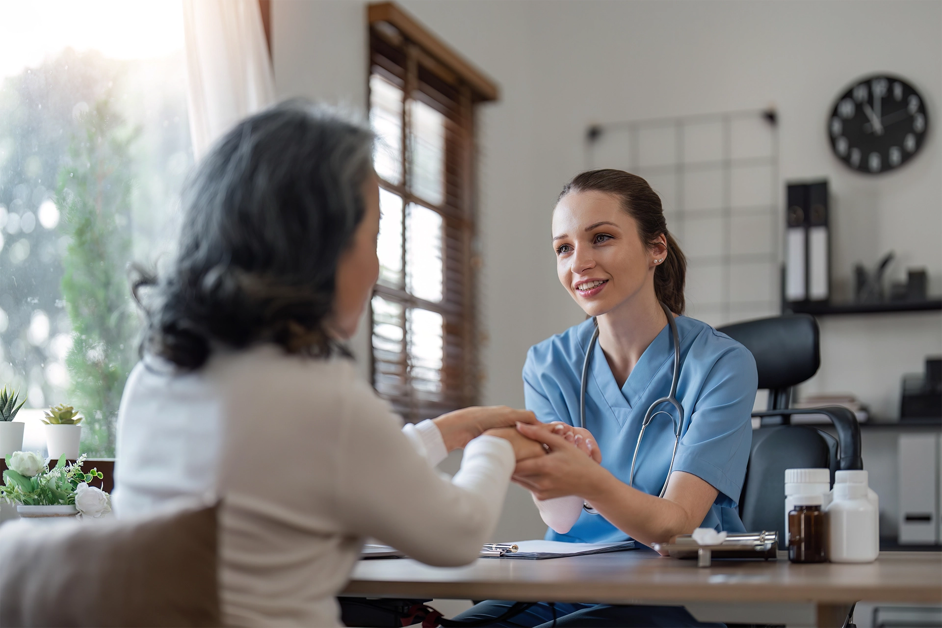 Hospice nurse providing compassionate guidance and support to a patient during a care consultation.