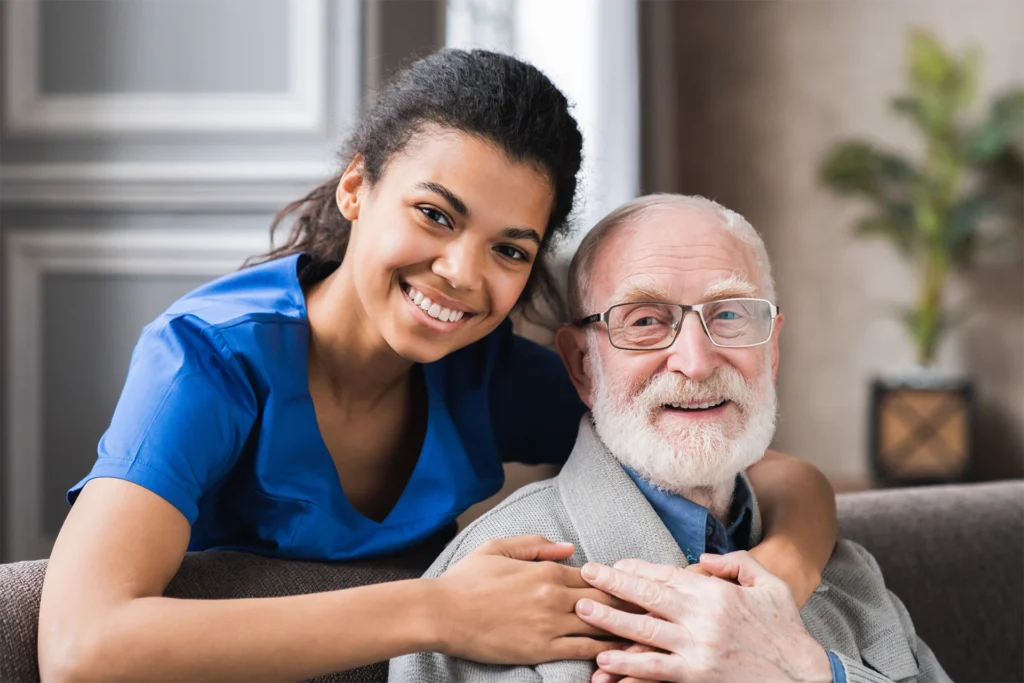 Hospice nurse providing compassionate support to a senior man